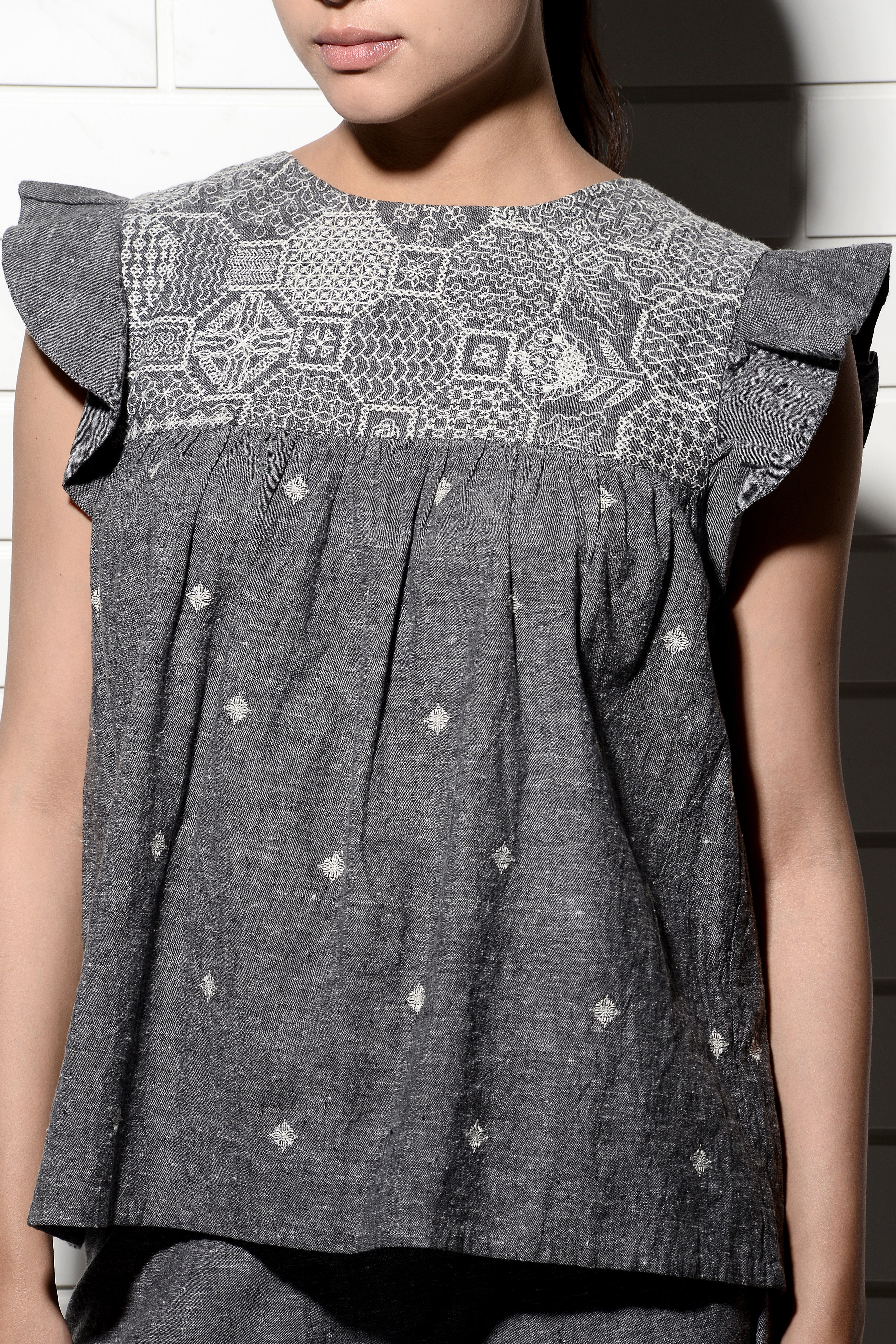 Muqarna embroidered Top with ruffled sleeves
