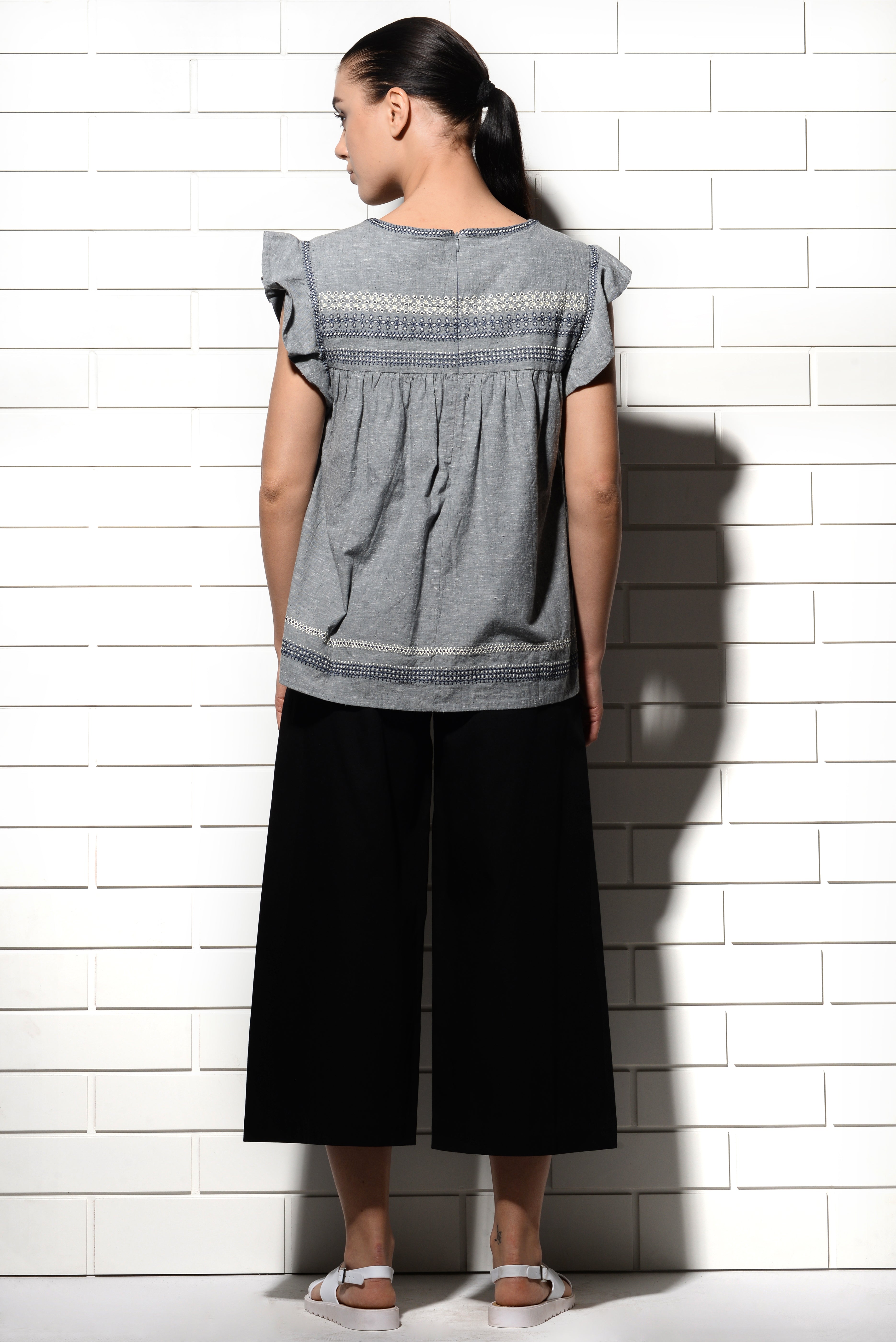 Muqarna calligraphy Top with ruffled sleeves